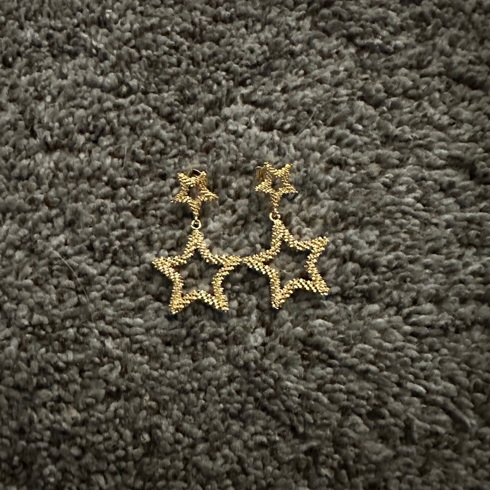 Gold star dangle earrings